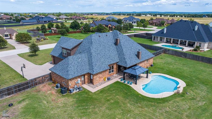 Welcome to the Home You've Been Waiting For! Located in the highly desirable and exclusive Pack Saddle Creek neighborhood, this stunning custom-designed home is nestled on a private cul-de-sac and showcases the very best of country living, yet still close to town. Crafted to maximize the feeling of country living with the grace and beauty of a rustic retreat, this residence invites nature inside through expansive windows that flood the home with natural light from sunrise to sunset. Step inside to discover an open-concept layout thoughtfully designed for modern living and effortless entertaining. At the heart of the home, the gourmet kitchen features a spacious pantry, granite countertops, stainless steel appliances, and bar seating-perfect for casual meals or hosting friends. The elegant eat-in dining area offers hardwood floors and a gorgeous stone accent wall. The home offers two luxurious primary retreats-one on each floor-each with its own ensuite bath, ideal for multi-generational living or hosting guests in style. A versatile fifth bedroom can serve as a study, home office, or creative space rounding out the functionality of this entire property. The resort-style pool is perfectly positioned to take in the spectacular West Texas sunsets, while enjoying the back patio entertaining area and the massive backyard! Whether you're lounging poolside or enjoying a quiet evening under the stars, the outdoor areas are designed to be as inviting as they are beautiful. Additional highlights include: Prime cul-de-sac location for privacy and tranquility, access to award-winning schools, top-rated restaurants, and premier healthcare. This impeccably maintained home is more than just a place to live-it's a lifestyle defined by elegance, comfort, and unforgettable views. Don't miss your opportunity to own a piece of West Texas with this immaculately designed and cared for home!