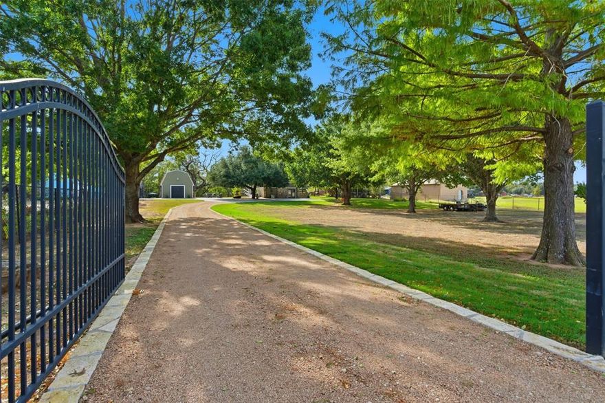 Welcome to your River Side Wonderland.  Completely updated 3-bedroom, 2-bath home with a bonus room, nestled on 1.4 beautifully maintained acres. The property is fully fenced — iron across the front and wood privacy fencing on the sides. A rock-lined crushed granite drive leads to expansive concrete parking and walkways surrounding the home and workshop.  Mature cypress, oak, pecan, and peach trees shade the grounds, while the gentle, fertile soil is perfect for any garden or flower bed. A concrete drive runs along the east side of the property, ending at a stunning granite rock patio on the banks of the Brazos River — an ideal setting for gatherings, parties, or quiet evenings by the water.  Enjoy a perfect swimming hole or launch your kayak right from your own backyard. Fishing is excellent — from striped bass to yellow catfish. Inside, the home features solid wood floors, antique beadboard ceilings, large windows with breathtaking River views, and a modern kitchen with stainless steel appliances, tile countertops, all new craftsman solid wood cabinets. New roof in 2020, New HVAC 2017, both bathrooms remodeled. Perfect for Short Term rental