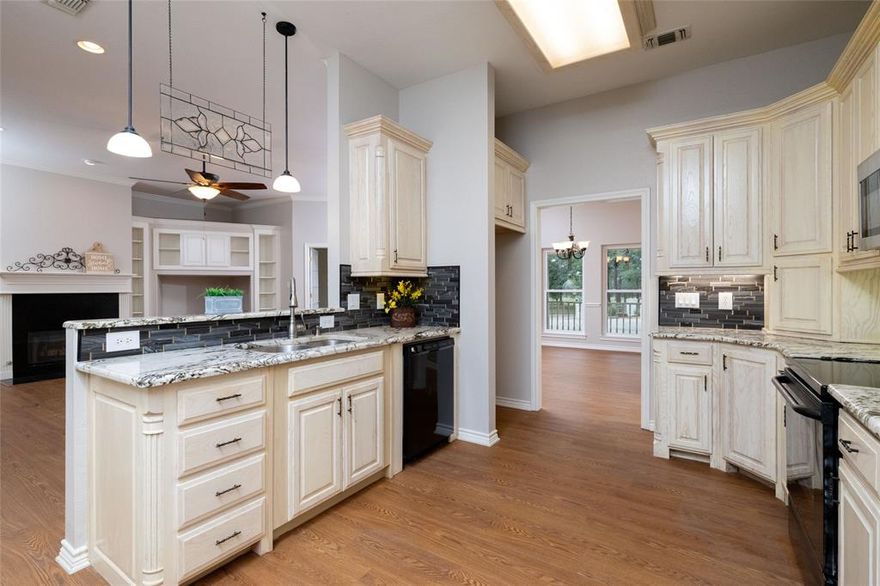 Enchanted beginnings and endings are here with cozy covered patios, porches galore and generous well thought out spaces inside as well as outside.  A huge screened in porch room accentuates the flow of the home with new Anderson windows added in 2021. The sunroom or porch room is wired for a hot tub. Walk into the peaceful and picturesque backyard with outdoor rock stepping tiers into the custom nooks and spaces beyond. Single story split 3 bedroom plus office or den or even a 4th bedroom. Three bedroom walk in closets. New custom kitchen in 2021 with extra bar tops, counters and a center island with specialty lighting to attract even the most discerning cooks and entertainers. Fresh new interior paint throughout including the oversized garage with an attic lift in the garage. The expansive living room offers a gas fireplace, custom built in shelving and more than enough entertaining space with an open flow into the kitchen and sun porch room. Other extras include Leaf Filter on the gutters, new AC in 2018, new garage door opener and mechanical in 2025, tankless hot water heater in 2024, partial new roof on the front in 2025 and several rooms with extra wide doorways to enable use of a wheelchair if required.  This home and adjacent lot is undeniably the perfect blends of new, existing and a peaceful and restful oasis with easy access to Lake Bridgeport.  There is a swim beach, fishing pier, marina area in Runaway Bay and the Northside Marina located on the north side of the Lake as well.  There are boat slips available through the City.  There is a City community swimming pool that is open in the summer months, two outdoors parks and a rich history.  The towns of Bridgeport and Decatur offer fine dining and various shopping options all within 25 minutes from The Bay. Dallas Fort Worth is less than an hour away with DFW airport an easy access.  Enjoy this small community offering a hilly and wooded setting situated above Lake Bridgeport.