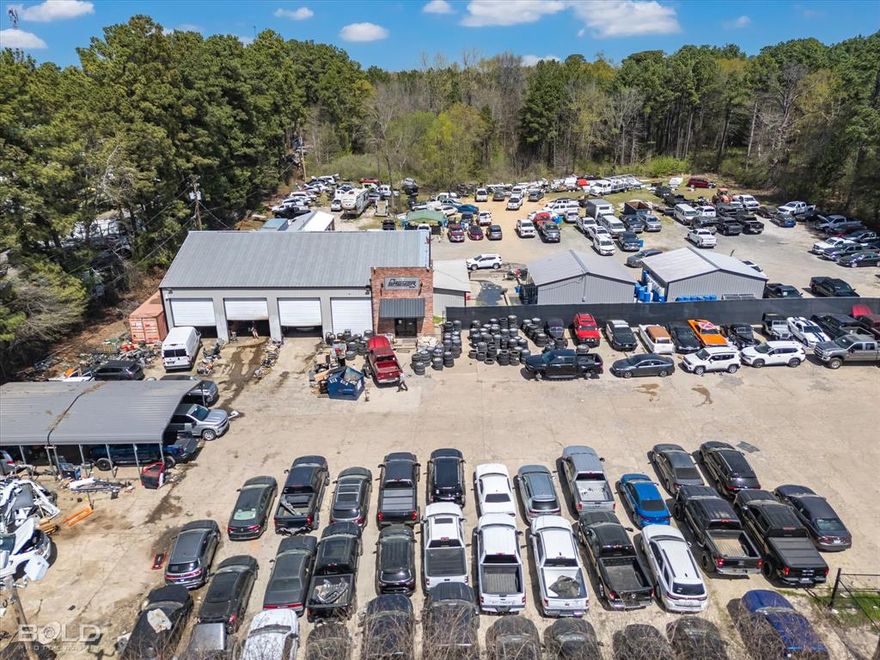 Prime industrial property offering 7,010 SF of versatile space on 5.99 acres. This facility includes 1,777 SF of office space, 314 SF of storage, 2,616 SF of warehouse, and two 750 SF work bays. Additionally, an 803 SF remodeled trailer provides extra office or storage space. The paved parking lot spans approx. 1 acre, with an additional 1.5-acre gravel lot for extra storage or vehicle access. The fully fenced perimeter ensures security, making it ideal for industrial operations. Conveniently located near I-20, 3132, & I-220, offering easy access for logistics and distribution. Great layout with spacious offices, work bays, and warehouse space—a perfect fit for various business needs.