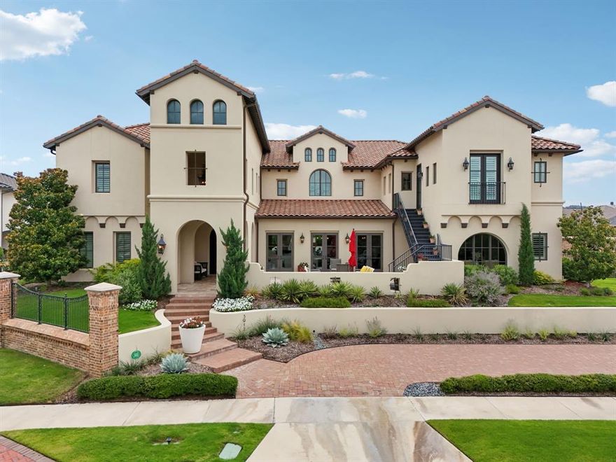 Offered for the first time since construction, this privately held Mediterranean estate is tucked behind the gates of Frisco’s prestigious Newman Village. A serene front courtyard welcomes you, framed by custom hand-crafted wood doors which set the tone for the home’s refined character. Inside, sculpted archways, streaming natural light, and rich hardwood floors create a graceful flow throughout. The kitchen was just renovated with Taj Mahal quartzite countertops and imported Italian tile backsplash, blending modern sophistication with everyday function. It also features Thermador Professional appliances, a built-in Miele espresso-coffee station, reverse osmosis water filtration, and a hidden catering kitchen. The primary suite is experiential in every sense. A $120,000 renovation introduced hand-applied Tadelakt plaster shower walls, floating white oak vanities, imported marble flooring, and ambient LED lighting, creating a spa-like bath sanctuary. The casita is fully connected to the main home but offers its own private entrance, ideal for extended family, guests, or flexible living arrangements. A dedicated office with hidden 2nd office area anchors your workday, while a media lounge, climate-controlled 200-bottle wine vault, and flexible bonus room invite relaxation and entertainment. The home is automated with an Elan system for lighting, entertainment, pool-spa, patio screens, security & cameras. The pool, designed and built by Pool Environments, features a heated and chilled pool and spa with in-floor cleaning system. The outdoor kitchen, gas fireplace, and motorized screens create year-round use of the oversized patio, while the property is surrounded 360 degrees by a custom mosquito misting system. The 11ft ceilings in the three-car garage includes a lift system option to accommodate up to four vehicles. Located just blocks from PGA, Fields development, this home offers, modern upgrades, lifestyle flexibility, without the $5M new construction price tag.