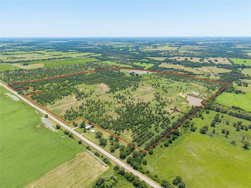 • Take a look at this!!  
• 164.08 acres of irrigated Pecan orchard with approx. 3500 Wichita and Cheyenne trees, 5 irrigation wells (1 with 2 hp pump, 3 with 1-1.5 hp pumps and 1 with a .50 hp pump) with all wells connected underground to irrigate the orchard in 2 zones.  
• There is also a 30’x80’ metal drive through equipment building with electricity and lights, a cement floor, 2 bathrooms, (one with a shower and utility room with full size washer-dryer connections) and a well for the building with a .75 hp pump + an old well with a windmill.
• Besides the orchard, this beautiful property includes a 3.8-acre lake and a second 2 acre lake. The 2 acre lake includes a floating lake pump and is in place as a backup for the orchard irrigation system - seller does hold a transferable TCEQ irrigation permit.  Both gorgeous lakes are stocked with large catfish and bass.
• Lots of Whitetail deer and other wildlife – great place for recreation.
• The ranch is almost all in Coastal Bermuda grass pasture, has good fences and gates and is currently running cattle.
• Property is easily accessed with the main gate on paved FM 2318, also CR 427 frontage on 2 sides.
• There are lots of future building site possibilities as there are several electric meters throughout the property.
• Call us today to schedule a viewing!!