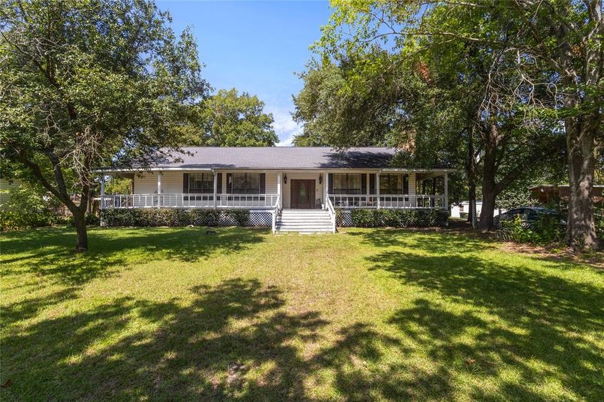 Escape to a home with abundant space, offering tranquility and lush green views. With its peaceful yard shaded by mature trees, this property provides a haven for relaxation or outdoor play. Just minutes from Lake Palestine. 
Sitting on 7 expansive lots—nearly 0.44 acres—this house stands out at the end of the road, ensuring privacy and ample room. The spacious 2,516 square feet includes three bedrooms, three bathrooms, a formal foyer, and a living area with a stunning brick fireplace.
Imagine hosting guests in the open dining room and well-designed kitchen or enjoying the extra-large den with a cozy wood stove. The office, equipped with an attached bathroom, adds extra convenience for those who work from home.
The screened back porch with laundry facilities, the master suite with walk-in tub and double vanities, and a 2-car carport with workshop-ready storage are perfect for a visionary buyer. While this property needs some repairs, its incredible value ensures it can be transformed into your dream home. Sold AS IS, act now!