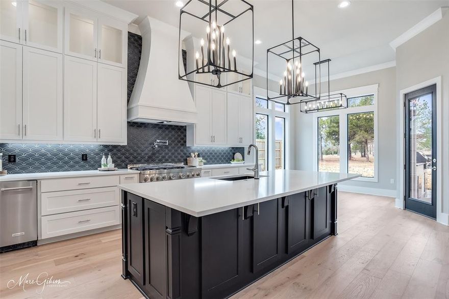 Just Completed New Construction!  Gorgeous European Design in the coveted Southern Trace neighborhood. This modern European home is what dreams are made of. This home features an open floor plan with walls of windows and soaring ceilings. The large living area has built-ins, a custom fireplace in the living room, primary bedroom, and the back patio. You will adore cooking meals in this chef's kitchen with a gas range, griddle, double ovens, ice machine, and wine cooler. Retreat to your primary suite that features cathedral ceilings with wood beams, a fireplace, and a spa bathroom with a massive walk-in shower, free-standing tub, and a large walk-in closet with built-ins. Upstairs is one bedroom plus a media room that can be used as a 6th bedroom if needed. Pool-sized backyard and plenty of room to roam! This is a must-see home!