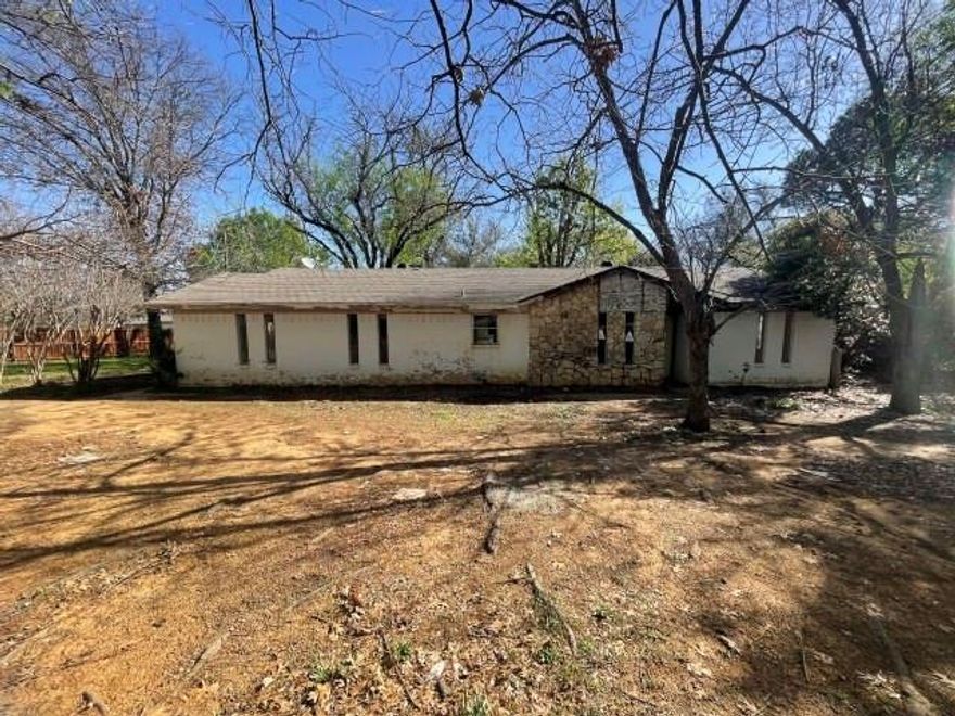 Custom brick three-bedroom, two-bath home on an acre lot. Pretty area with lots of trees and close to schools and commute.  Sold completely as-is.