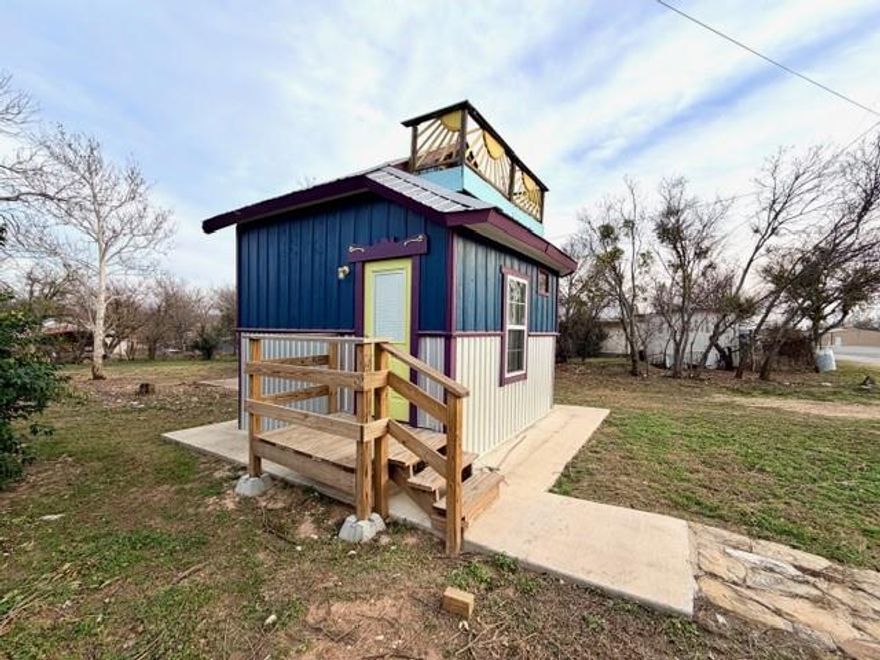 Calling all tiny home lovers and savvy investors! 
This adorable two-story tiny home proves that great things come in small packages. 
The smart layout features a loft style bedroom upstairs, while the downstairs offers a functional kitchen with refrigerator, a flexible living area with a pull up down table to maximize space, and a full bathroom complete with an oversized beautifully tiled shower. Proof that small spaces can still feel luxurious.
 Every square foot is thoughtfully designed for comfort, style, and efficiency. Sold fully furnished and styled to impress. Just bring your suitcase or your guests! An excellent short term rental opportunity located across from the high school, with a generously sized lot offering future expansion potential for additional tiny homes, RVs, or manufactured homes.
Whether you’re looking for a low maintenance short term rental, a unique Airbnb offering, or a property with room to expand, this tiny home delivers big returns in a small footprint. Opportunities like this don’t come along often. Perfect for investors ready to capitalize on the growing demand for unique, high yield rentals.