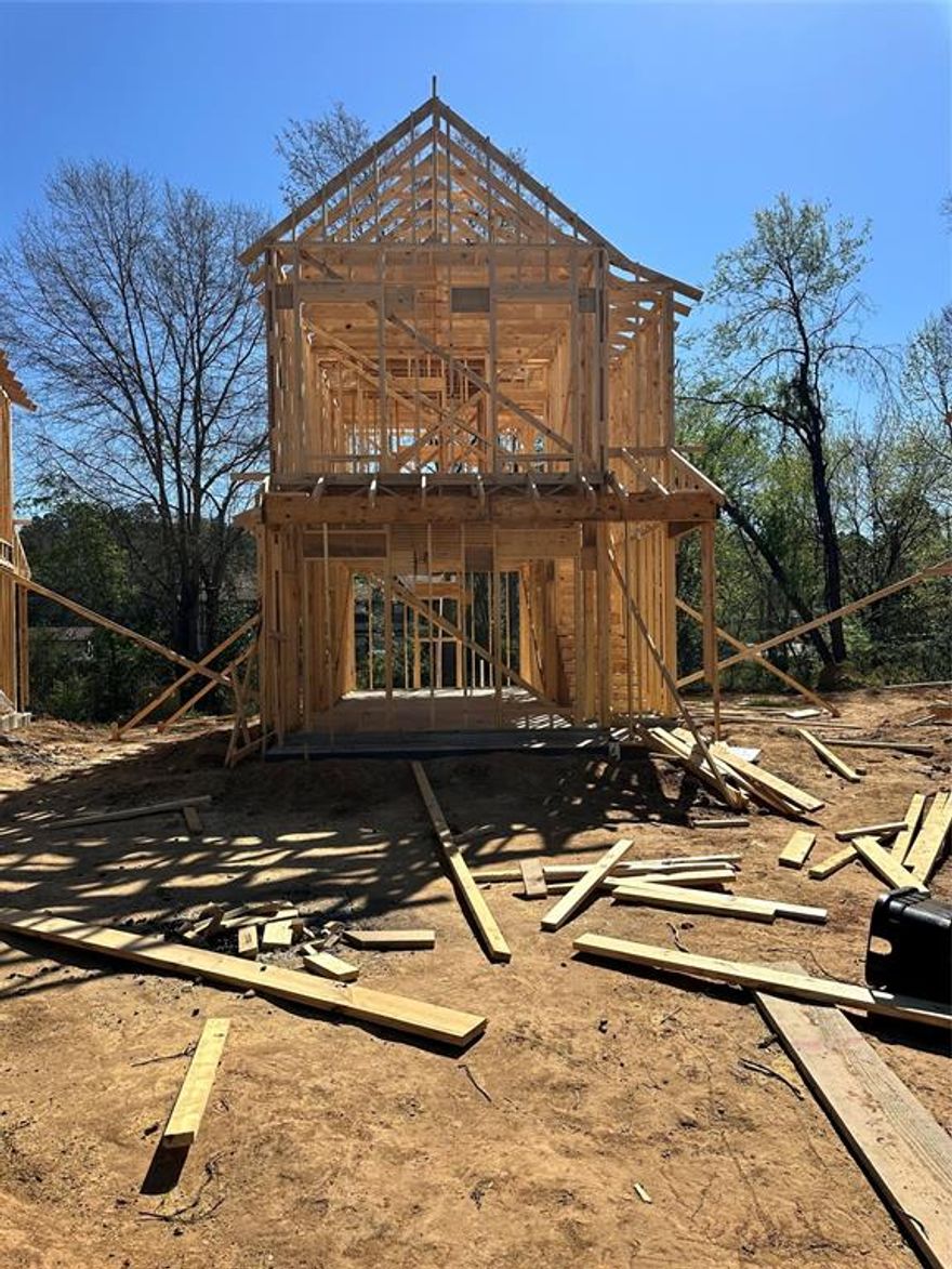 Presenting a delightful two-story patio home that is currently under construction in the heart of downtown Greenwood! Just a block away from the town square and Veterans Park, this home features a variety of impressive upgrades, such as quartz countertops, a stackable washer and dryer, radiant barrier roof decking, and an electric fireplace in the living area. The staircase is adorned with stylish wrought iron spindles, adding elegance to the space. Downstairs, enjoy the luxury of vinyl plank flooring, while upstairs offers cozy carpeting. The second floor includes two spacious bedrooms and a stunning main bath, complete with tiled surround walls around the tub and a quartz countertop. Additionally, the property boasts a privacy-fenced backyard for your enjoyment!