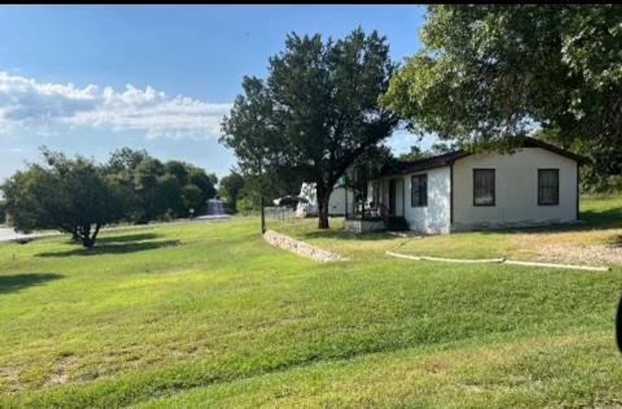 Just 0.4 miles from the boat dock, this cute and updated lake-area home offers strong value and flexibility — perfect for first-time buyers, downsizers, weekend getaways, or potential short-term rental use. Located near Historic Downtown cafés, restaurants, shopping, and entertainment with quick access to Hwy 377 for an easy drive to Fort Worth, Stephenville, and Tarleton State University.

This all-electric home with city water features an open-concept living, dining, and kitchen area, spacious bath with storage and washer and dryer, and a comfortable bedroom with His-and-Hers closets. The front living area provides flexible space for a home office or additional sleeping nook.

Enjoy the covered front deck (approx. 100 sq ft) perfect for relaxing after a day at the lake. Renovations completed within the last two years create a move-in-ready feel. Appliances convey, and select furnishings may be included, making this an affordable lake-area opportunity with lifestyle and income potential. 

The house sits on Lot 533 & Included in the listing are 2 additional vacant lots please see private remarks.