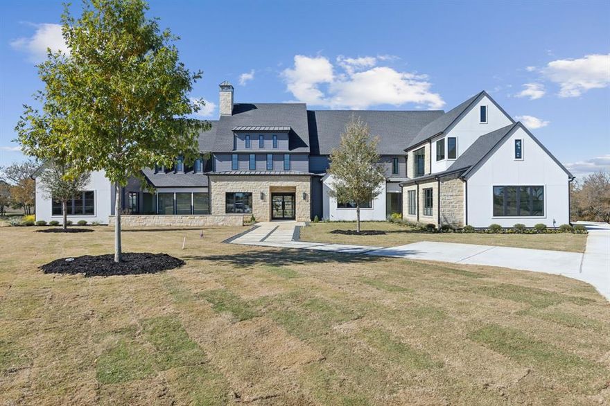 A gated entry welcomes you to the prestigious Barratt Lake Estates in Lovejoy ISD offering unparalleled tranquility & peaceful isolation yet minutes to all desired amenities. Set on a premium 2-acre lot, this exquisite Ron McHam custom estate is an architectural masterpiece, meticulously constructed with superior craftmanship like no other. Modern overlay custom cabinets, light stain oak floors, smooth fir beams, shaker moldings, wired sound system, foam insulation, TJI silent floor system & Energy Star certified. Grand kitchen, prep kitchen & two bar areas. Main floor primary suite with double spa bath. Your great room & dining room display solid glass walls, 34ft ceiling & automatic sliding glass door creating a seamless transition to outdoor kitchen, dining & living area enclosed with powered screens to enjoy year-round. Luxurious outdoor retreat with modern designed pool, spa, private lake views, professionally landscaped grounds & surrounded by mature trees for ultimate privacy.