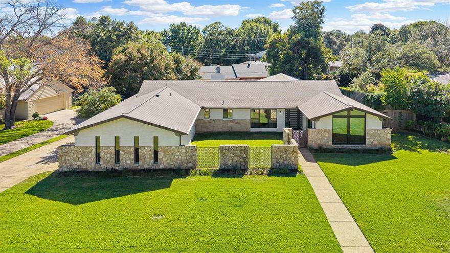 This fully renovated mid-century retreat on a .36-acre lot in Overton Park blends flexible living and indoor–outdoor comfort. Its single-story layout offers four bedrooms, one easily serving as a dedicated office or guest room for work-from-home or overnight guests. A private front entry and enclosed courtyard create a sense of arrival. 
Inside, natural light floods the open living, dining and kitchen spaces. Warm hardwood floors complement modern finishes, while the kitchen boasts quartz counters, fine finishes like a built-in glass rinser, and a huge walk-in pantry. The adjacent dining area easily seats a crowd while overlooking the pool.
The split-bedroom design ensures privacy. The primary suite offers a spa-like bath with soaking tub, open shower and dual vanities plus two oversized closets, one reinforced as a storm shelter. Two secondary bedrooms share a well-appointed bath, with a powder room for guests. A fourth flex room functions as an office or guest bedroom. 
New sliding glass doors lead to a sparkling pool and private backyard oasis. The enclosed front courtyard can become a serene garden or outdoor lounge. Few homes in the neighborhood feature a dedicated front entry and multiple outdoor retreats.
Recent updates include all-new windows, electrical, plumbing, sliding glass and exterior doors, spray-foam and blown-in insulation, proactive termite protection, and updated roof and HVAC. These upgrades enhance energy efficiency and comfort.
Enjoy Overton Park Elementary, proximity to TCU and premier shopping and dining at Clearfork and along the Trinity River trails.