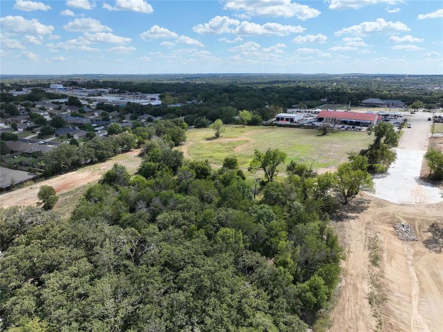 PREMIER COMMERCIAL DEVELOPMENT OPPORTUNITY ON HIGH-TRAFFIC US HIGHWAY 180 CORRIDOR, WEATHERFORD, TX (PARKER COUNTY) An exceptional opportunity awaits to acquire a prime, development-ready 2.4-acre commercial tract strategically positioned just off the highly active US Highway 180, the major thoroughfare connecting Weatherford and Hudson Oaks. This land is situated in the heart of Parker County, officially recognized as the highest-growing county in the state of Texas, offering immense potential for business growth and long-term investment appreciation. The site is truly shovel-ready, having been successfully rezoned to C-1 Commercial, with the plat officially approved by the City of Weatherford, and all major utilities already run to the site boundary. A significant advantage for developers is the land's predominantly level topography, which will substantially simplify site preparation and reduce overall construction costs. High visibility and unparalleled customer reach are ensured by the property's close proximity to Highway 180, which sustains a powerful daily traffic count ranging from 20,000 to over 40,000 vehicles. Capitalize on the exploding economic vitality of Weatherford and secure your strategic location in one of Texas's most desirable growth markets.
