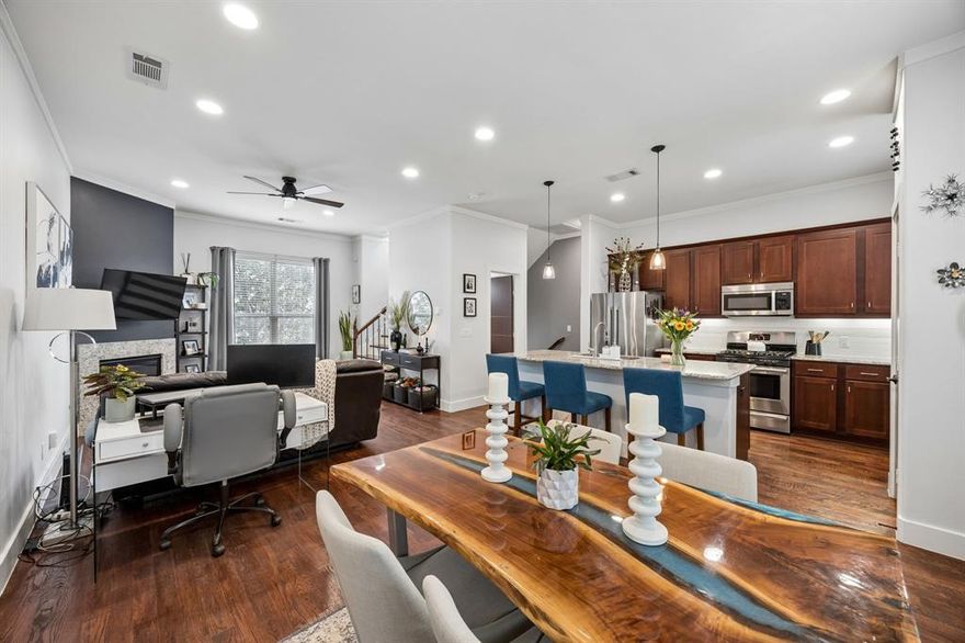 Alta Vista West’s premier offering has arrived. Perfectly positioned just three blocks east of the vibrant Lower Greenville district, 5875 Ross Ave #9 offers a refined lock-and-leave lifestyle within walking proximity to the city's most iconic dining and nightlife. Upon entering the gated community, you are greeted by meticulously maintained grounds featuring mature magnolias that lead to your front door. This sophisticated residence is defined by rich nail-down hardwood floors and an open-concept second level bathed in natural light. The heart of the home is a spacious living area anchored by a sleek gas fireplace, flowing seamlessly into a chef’s kitchen with a Bosch stainless steel suite, gas range, and wine fridge. On the third level, both bedrooms serve as private retreats with full ensuite baths. Modern upgrades include an attached two-car garage with a dedicated EV charging station, Smart Lock, and smart thermostat. Residents enjoy low HOA dues and a private rooftop terrace with stunning views.