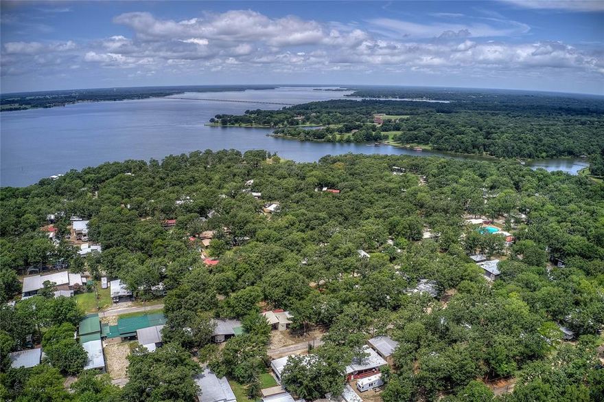 Welcome to your ADORABLE & AFFORDABLE lakeside haven! Nestled on World Famous Lake Fork in Sun Eagle bay resort, this unique property is your next weekend getaway or full time living option! Offering an unbeatable combination of natural beauty, comfort, and adventure. Whether you're looking to go fishing, swimming or entertain guests, this one delivers without a hefty monthly mortgage!

There is plenty of room for the whole family with a renovated 1982 RV with a holding tank, 12x24 additional structure for living and dining, and a 10x12 Bunkhouse for your overnight guests. Generous amount of additional parking for cars, boats, and RVs. Make memories sitting around a fire, sipping coffee in the mornings on the covered patio and take in all the things that Lake Fork has to offer!

Perks of living in Sun Eagle bay include private boat ramp, fishing pier, pavilion and the largest community swimming pool in Wood County! Make this one your happy place and permanent retreat!