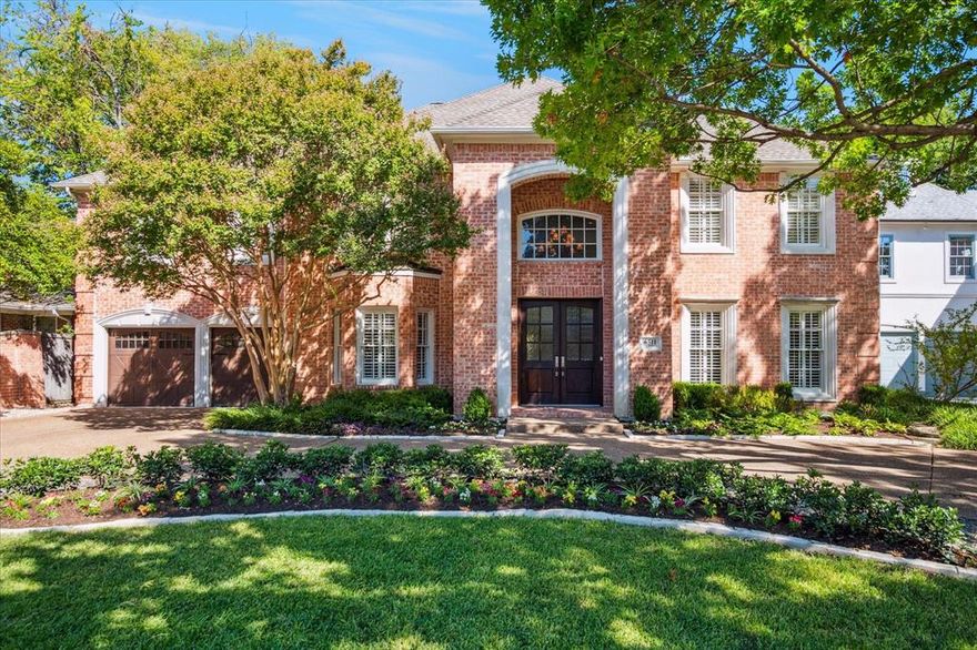 Situated in the heart of Preston Hollow, this warm and inviting home perfectly blends convenience with comfort. Spanning 5,172 square feet, this residence offers spacious and thoughtful living spaces perfect for the modern lifestyle and entertaining family and friends. The two-story entry is filled with natural light and welcomes you in with beautiful hardwood floors, tall ceilings, traditional moldings, and oversized formal living and dining spaces. An open floor plan across the back includes a fully equipped kitchen - complete with a center island, double ovens, bar seating, and abundant storage, an adjacent breakfast area, and large family room with fireplace and wall of windows overlooking the incredible outdoor entertaining spaces. The home also features a downstairs primary suite with a fireplace, his and her walk-in closets, and bath with double vanities, and separate shower and tub.  An additional downstairs flex room could be used as an office or additional living room. Upstairs features an open living or playroom area, three secondary en-suite bedrooms, and an amazing media room with wall of built-ins. The backyard continues to impress with a private oasis for relaxation and entertaining, including a covered patio, open patio, outdoor kitchen, stunning pool, and separate turfed yard area. Beautifully landscaped property with mature trees, an attached 2-car garage, expansive circular driveway, and traditional curb appeal make this home an opportunity not to miss!
