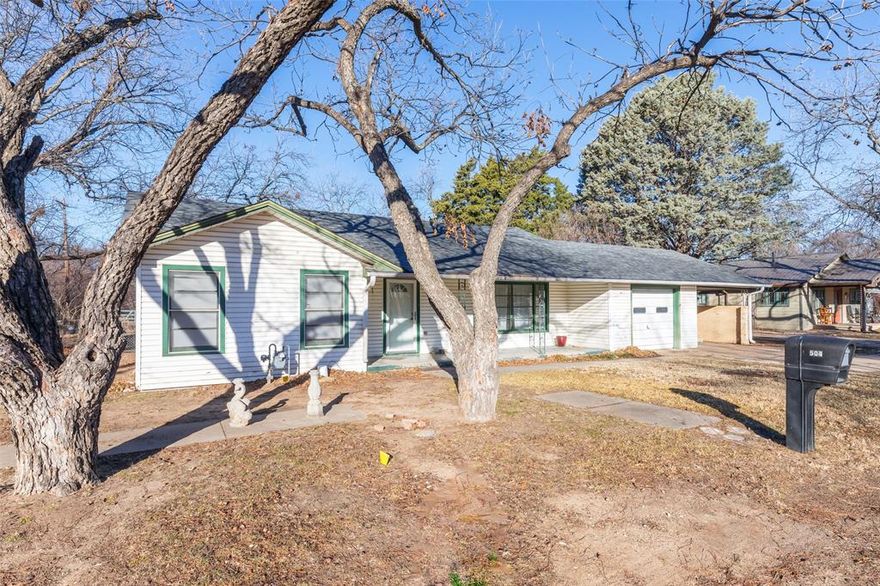 Spacious 2 bed 1 bath home with hardwood floors on a LARGE lot in an established neighborhood. Storm shelter. Storage Building.