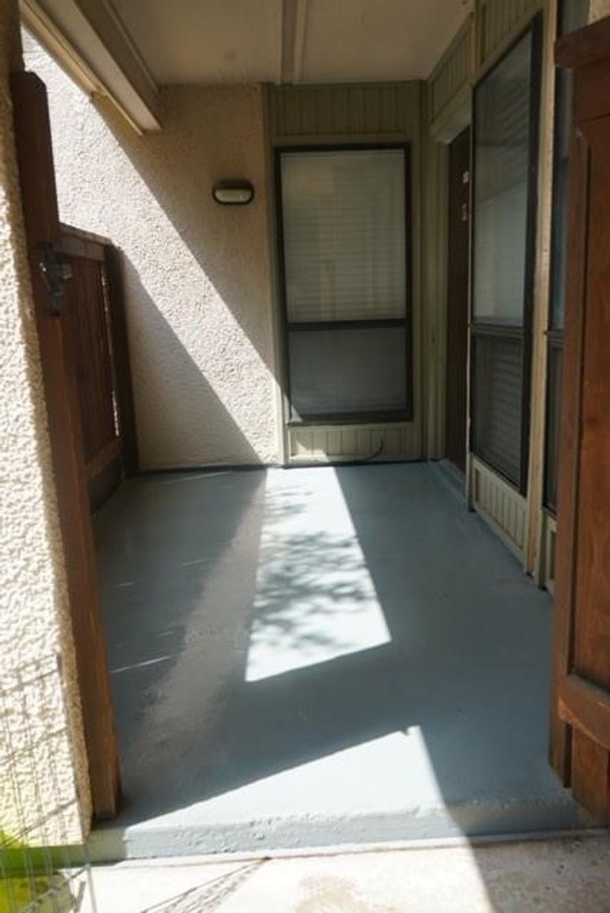 Conveniently located and MOVE IN READY!! One story, first floor, 2 bedroom, 1 bath condo with cozy covered patio. Primary bedroom has private dressing area and large walk-in closet. Second bedroom has built in desk and lots of shelves. Neutral paint and new flooring all throughout, gallery style kitchen and dining room is open to spacious living area. This space is ready for investors to rent or first time home owners to move in. One assigned covered parking space.