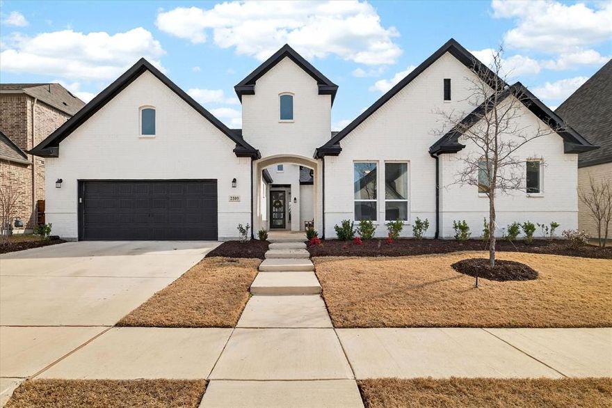 Welcome to 2309 Juniper Ln, where thoughtful design, natural light, and everyday comfort come together in a beautifully maintained home zoned to highly rated Argyle ISD. A rare private front courtyard creates a quiet, inviting arrival before you step inside to soaring ceilings, expansive sightlines, and warm wood flooring that open the living space. Oversized windows frame peaceful backyard views and fill the home with soft natural light, creating a calm and elevated atmosphere throughout.
At the heart of the home, the open-concept kitchen is designed for gathering and function, featuring a striking waterfall island, abundant cabinetry, designer finishes, and seamless connection to the main living and dining areas, making it ideal for hosting or everyday living. Nearby, a cozy hearth room with fireplace offers an intimate space for slow mornings or quiet evenings, while the dedicated media room provides the perfect setting for movie nights and game days. A bold designer office near the front adds privacy and personality for working from home.
The primary suite is generously sized and thoughtfully separated, offering a peaceful retreat with a spa-like shower, freestanding soaking tub, dual vanities, and a boutique-style walk-in closet. Secondary bedrooms are spacious and flexible for guests or family, while practical spaces like the well-appointed laundry room and ample storage support effortless daily living.
Sliding glass doors extend the home to a large covered patio and private backyard with no rear neighbors, ideal for relaxing or entertaining in quiet Northlake surroundings. With timeless finishes, functional spaces, and a premier location, this home delivers a rare balance of style, comfort, and long-term value.
Beautifully cared for and designed to truly live in, this is a home that feels right the moment you walk through the door.