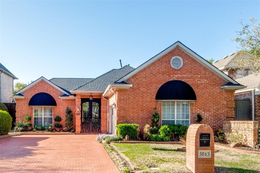 Welcome to 5843 Preston Fairways! Once you walk through the ornate double doors (2018) you will see this home is filled with natural light thanks to all the large windows adorned with custom plantation shutters (2018). The floor plan has 2 spacious living areas, separate dining room, breakfast nook, kitchen with quartz countertops (2018) with ample counter & cabinet space, gas cooktop, double ovens, generous island & walk-in pantry. You have views of your meticulously kept pool from all living areas, including the primary bedroom. Living room and primary bedroom have gas fireplaces. Primary bath includes 2 vanities and 2 closets. Exterior awnings are new (2023). Wonderful location near tollway, Preston & 190. Small rear turfed yard (2023) perfect for pets. Swing garage is oversized with good storage. Plano ISD! See transaction desk for list of improvements.