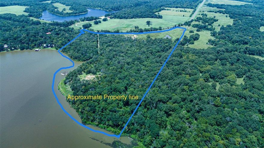 This tract is one of those few opportunities to secure acreage along the shorelines of Cedar Creek Lake.  This beautiful 35.81-acre property has an  impressive 1,848 feet of natural shoreline. What an investment to simply hold and enjoy with ag exempt property taxes of less than $100 per year until the timing is right for you to develop or build your family lakeside compound!  Want to enjoy waterfront weekends meanwhile? There is currently power, water and septic set up with an ultra modern container home that is compact, but everything one needs for a peaceful weekend! 
Scattered mature trees abound throughout this property; beautifully framing these elevated waterviews. Countless potential to develop these parcels into luxury waterfront home sites like those across the cove, tiny home community,  RV park, acreage homes with marina slips, ample road frontage for storage units, covered boat storage, let's explore the possibilities! SELLER FINANCING AVAILABLE 30% cash down.