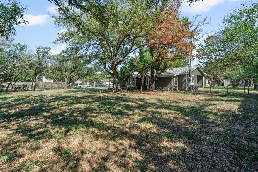 Totally remodeled home on almost a third acre just minutes from Lake Granbury for only $234,900! What?! It's true! Seller LOVED this home but had to move due to a job transfer so their loss is someone's gain. Will it be YOU? This home is nestled within a lakeside community. There's plenty of room for family gatherings with a large living area, dining and eat in kitchen. The covered back porch is great for entertaining. You're going to love spending time in your back yard, too, and so will your dogs!  There's tons of shade from all the trees, too. Hurry, this home will not last long!