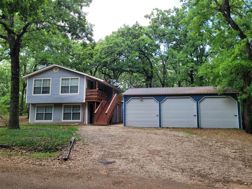 Welcome to your quiet retreat near the desirable lake community of Cedar Creek Lake—where comfort, space, and lake living come together beautifully. Sellers are motivated to help buyer(s) become the next owner(s) of this charming 3-bedroom, 2-bath home that offers the perfect blend of everyday functionality and a relaxing getaway. The oversized primary suite features a private sitting area—ideal for a reading nook, office space, or quiet retreat—and direct access to a private balcony where you can enjoy peaceful mornings and evening sunsets. Cozy up by the wood-burning fireplace in the main living area, or step outside to your own private oasis. The backyard is fully enclosed with a privacy fence and designed for entertaining, highlighted by a large covered patio—perfect for outdoor dining, relaxing in the shade, or hosting weekend get-togethers after a day on the water. A cute storage building that is ideal for tools, hobbies, lawn equipment, or extra lake gear, along with a spacious 3-car garage that provides ample room for vehicles, lake toys, and more storage. Whether you're looking for a full-time residence, a weekend escape, or a great investment property, this Cedar Creek Lake home offers space, privacy, and a short stroll to the lake.