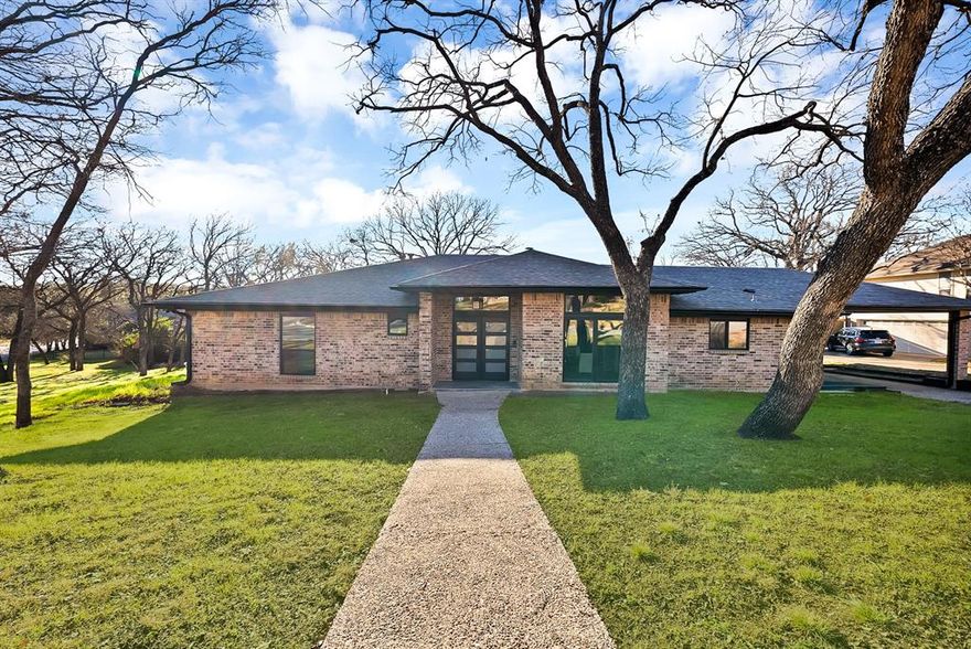 Newly renovated one owner custom home located in Southwest Arlington in the desirable Tiffany Park neighborhood. Conveniently located just minutes from I-20, I-30, 820, and Highway 360, making it ideal for commuters. Situated one block from Lake Arlington and within approximately two miles of two public boat ramps. This beautifully updated home features a chef’s kitchen, two new HVAC systems, new roof shingles installed on 11-25-24,new flooring, new lighting, all new appliances that convey, removal of popcorn ceilings, 3 full bathroom remodels, all new faucets, floor plan changes in the remodel, removal of all insulation and new insulation blown in, 2 new water heaters, new cabinetry throughout, new low E double pain windows and new doors through out the home. The open-concept layout offers abundant natural light with spacious living and dining areas on the main level. A large new deck spans the back of the home, perfect for outdoor entertaining. The main level includes the primary bedroom along with two additional bedrooms. The upper level features a second primary suite with a private bathroom, offering flexible living arrangements. This space could also be used for a large game room area. All the rooms are oversized and this home has tons of storage. The garage is oversized and the driveway is extra long so lots of additional parking. The garage is located on the lower level. Additional updates include a new sprinkler system and newly installed St. Augustine sod. The home sits on a beautiful lot with mature trees in a quiet, established neighborhood. Schools zoned for Ditto Elementary, Young Junior High, and Martin High School, this home is also a quick commute to private schools such as The Oakridge School and Pantego Christian Academy. Conveniently located near shopping, dining, and major thoroughfares. This property combines elegance, comfort, and exceptional location. This is a rare opportunity to own a renovated and updated home in this neighborhood.