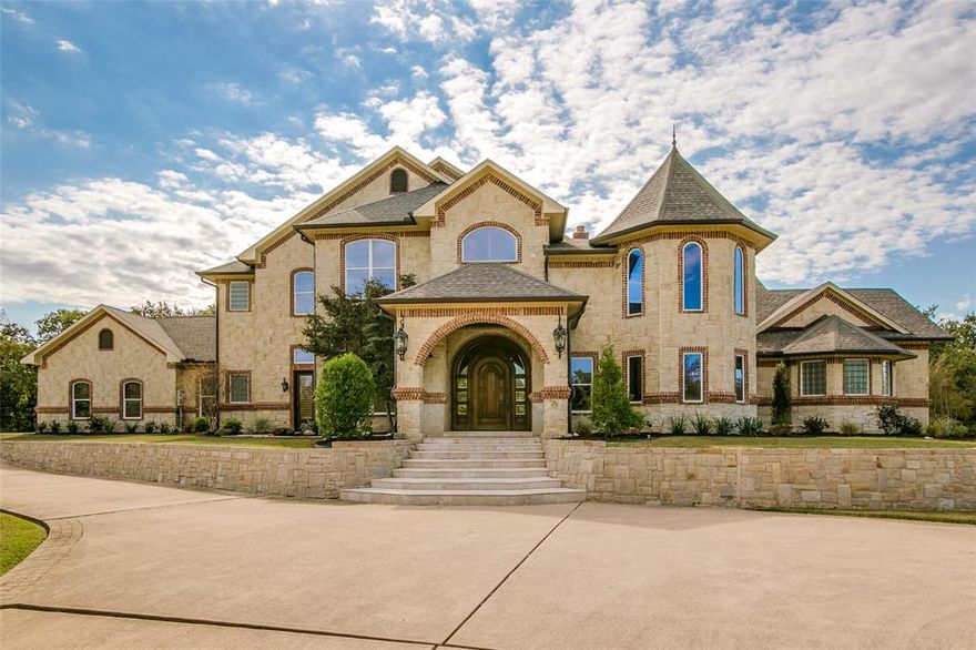 A rare and extraordinary luxury manor atop one of Grapevine's most scenic and secluded park like residential acreages. Architecturally striking and beautifully appointed, this sprawling custom estate offers quality finishes, unique style & comfortable spaces. The interior includes rich woodwork, elegant chandeliers and exquisite tiling detail throughout. Entertain in your covered outdoor living and open patios, or relax in the heated Claffey pool-spa after a jog or bike ride in the Horseshoe Trails; found just across Dove Rd. Ideally located near Grapevine’s many recreational activities, water sports, spectacular parks,quaint wineries, golf courses, resorts and historic Main Street shopping & dining district. This luxury estate brings a perfect combination of exceptional style, total privacy, unbeatable location and scenic views of the heavily wooded Corps property, breathtaking sunsets and Texas plains wildlife. 4 car garage with epoxy flooring, private pond. NO HOA!