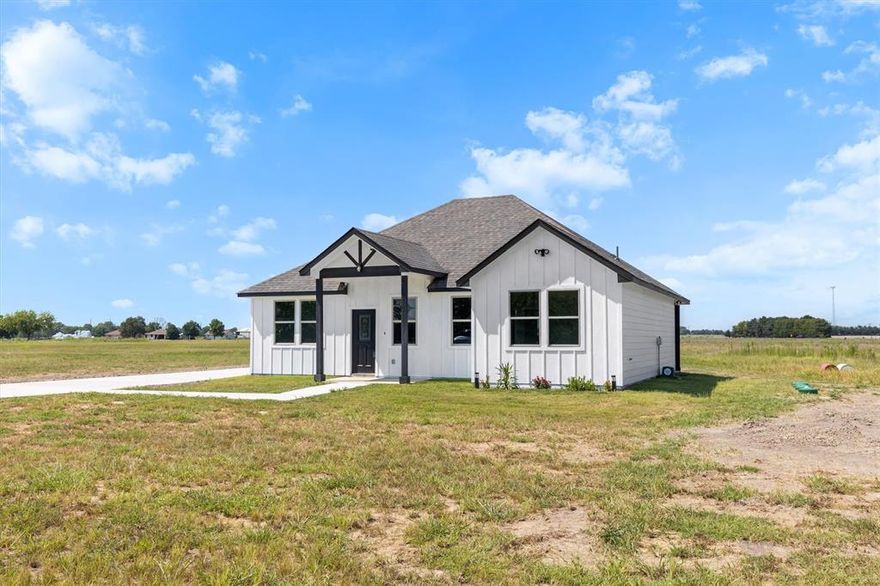 Discover the perfect blend of comfort and tranquility in this brand-new, traditional single-family home. Situated on a sprawling 2-acre lot, this 3-bedroom, 2-bathroom gem offers approximately 1600 sq ft of meticulously designed living space. Step inside to find durable vinyl plank flooring flowing throughout the open-concept layout. The kitchen, boasting gleaming quartz countertops, a large island with a chic light fixture – perfect for entertaining! The master suite provides a walk-in closet and a contemporary stand-up shower. Enjoy year-round comfort with ceiling fans in all bedrooms and the living area. Outside, relax on your inviting covered front porch or the charming small patio. A long driveway leads to a detached two-car garage, providing ample parking and storage. Experience peaceful country living with the convenience of quick access to the highway, retail stores, and a variety of restaurants. This is an incredible opportunity to embrace a serene lifestyle without sacrificing modern amenities! BUYER AND BUYER AGENT TO VERIFY ALL INFORMATION AND MEASUREMENTS!