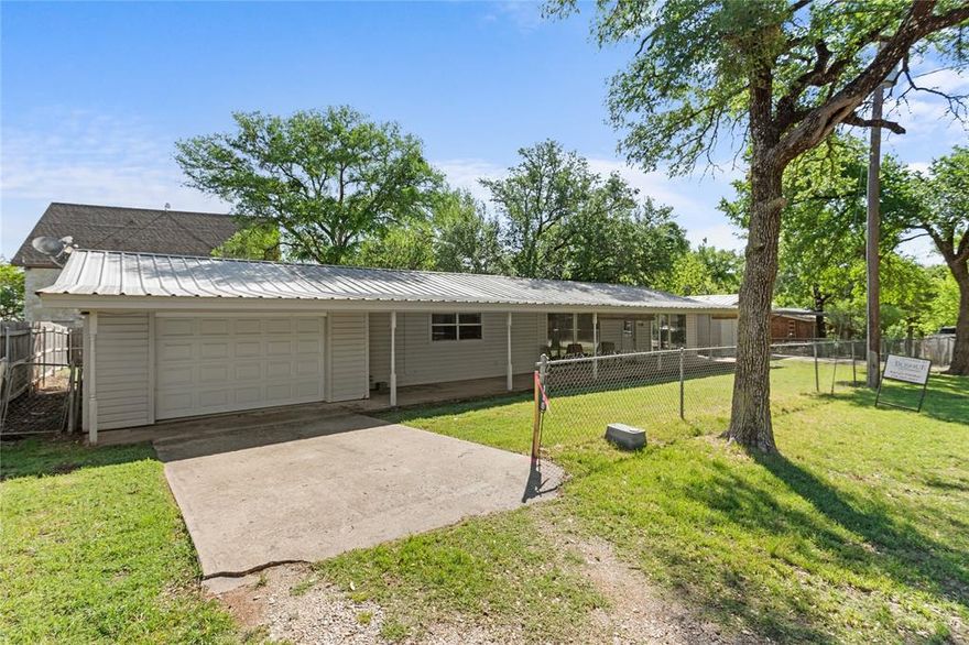 Escape to lake life with this 2 bedroom, 1 bath home near Lake Whitney!  The property includes two garages, perfect for boat storage, hobbies, or extra parking.  With its convenient location close to the lake, this home would make a great weekend retreat, investment property, or full time residence.  Enjoy peaceful surroundings while still being just minutes from fishing, boating, and outdoor recreation