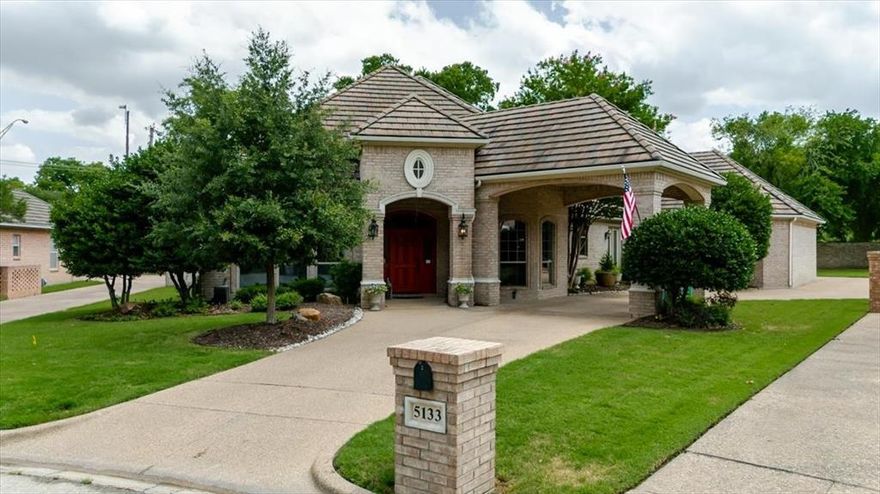 Tucked away on a peaceful cul-de-sac in a quiet, established neighborhood, this beautifully updated one-level home offers timeless charm and modern comfort. Tall ceilings and an open-concept layout create a spacious, airy feel, while abundant windows flood the interior with natural light. The stunning stone floors flow seamlessly throughout, complementing the striking gas fireplace that feels like a nostalgic step back in time. Every detail has been thoughtfully refreshed, inside and out—including lush, mature landscaping that enhances the home’s curb appeal and invites outdoor relaxation. This is single-level living at its finest, where character meets convenience.