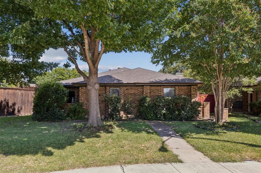 ***VA ASSUMABLE MORTGAGE 2.875% RATE with a balance of approximately $324,260 *** Tucked away in the center of the neighborhood in a quiet cul-de-sac and in RICHARDSON ISD, this beautifully maintained 3-bedroom home is full of charm and style. Gorgeous tile and hardwood floors flow throughout, leading to a spacious family room with a vaulted ceiling, a brick wood-burning fireplace, and a wet bar—perfect for entertaining. The kitchen features granite countertops, abundant cabinetry, a cozy breakfast area, and serene views of the backyard. The generous Owner’s Suite offers walk-in closets and a remodeled shower. Bathrooms have been recently updated with quartz counters, sleek new sinks, and modern faucets. Two additional bedrooms, each with walk-in closets, provide ample space for family or guests. Step outside to enjoy two landscaped patios—ideal for hosting gatherings or sipping your morning coffee—framed by beautiful artisan wood fencing.