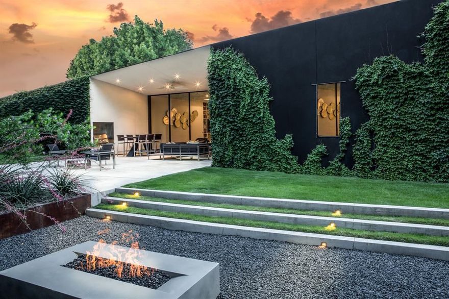 Featured in multiple publications including Dwell Magazine, Candy’s Dirt, the Dallas Morning News and The Parade of Homes, The WINNWOOD RESIDENCE is one of the very few LEED Platinum Certified houses in the Metroplex. According to the USGBC (Unite States Building Council) LEED-rated homes “use less water and energy and reduce greenhouse gas emissions.” Located on a .7 wooded lot across the street from White Rock Creek Park in Addison, this property was selected because of its unique and interdependent relationship with nature. This architectural masterpiece was designed to let the outdoors in throughout every room. 12-foot windows with sliding glass wall panels in every main area. Stained white oak floors in every room. Thermador and Bosch appliances compliment the exclusive Bulthaup German kitchen, known for its functional and ergonomic design, and granite plus neolith counters. Steps away from Beltline restaurants, Whole Foods and Village on the Parkway.