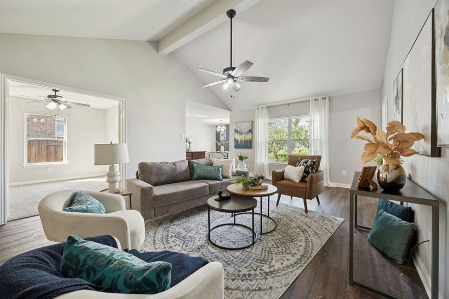 Tucked away on a quiet cul-de-sac in the growing community of Anna, this thoughtfully designed 4-bedroom home offers a welcoming blend of everyday ease and elevated finishes, all on a lot that feels unexpectedly open and private thanks to the wide, vacant field just across the street.
Step inside and you’re instantly greeted with light, flow, and a sense of calm. Luxury vinyl plank flooring runs throughout the main living areas, offering the warmth of wood with the resilience of modern design. Neutral tones, soaring ceilings, and wide windows pull in soft natural light, creating a space that feels as fresh as it is functional. At the heart of the home, the kitchen balances beauty and practicality with richly toned wood cabinetry, granite countertops, and a center island perfect for everything from morning coffee to weekend baking sessions. Just off the kitchen, the dining area invites shared meals and quiet moments, framed by a striking accent wall and a view of the backyard. The spacious living room encourages connection, while the fourth bedroom offers the flexibility to serve as a private office, guest room, or creative space, depending on your needs. In the primary suite, plush carpeting underfoot and a peaceful palette make it feel like a retreat, while the ensuite bath features a soaking tub, separate shower, dual vanity, and generous walk-in closet. The secondary bedrooms are equally comfortable, with room to grow, rest, and recharge. Step outside and you’ll find a large backyard with room to entertain and unwind. The covered patio sets the scene for everything from slow mornings to evening gatherings under the stars. With easy access to local shopping, schools, and highways, this home blends location and livability in all the right ways. And with no direct front-facing neighbors, you’ll love the quiet and space this cul-de-sac setting provides. The layout works. The finishes impress. And the possibilities feel wide open. Welcome home.