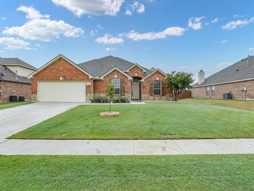 Don’t miss this Sendera Ranch gem on a Texas-sized lot! This single-story brick-and-stone home boasts striking curb appeal and abundant natural light. Inside, a spacious open floor plan with hard-surface flooring flows seamlessly to a covered patio and expansive backyard—perfect for entertaining. The open eat-in kitchen features a gas cooktop, stainless steel appliances, and a separate pantry, while the formal dining room is ideal for hosting. The private primary suite offers a walk-in closet, dual sinks, a walk-in shower, and a soaking tub. One of three guest bedrooms doubles as a home office or flex space, making this home as functional as it is inviting. Plenty of storage space in double door garage or 8x12 detached backyard shed. Residents of Sendera Ranch enjoy scenic walking & biking trails, greenbelts, parks & community pools just minutes from dining and shopping (Presidio Town Cross, Alliance Towne Center) and major thoroughfares (I35-W & Hwy 287) with easy commute to Fort Worth. Top-rated, family-friendly Northwest ISD schools are nearby adding up to a well-situated home that balances convenience and comfort with access to neighborhood amenities and generous sized backyard for gatherings or quiet evenings.
