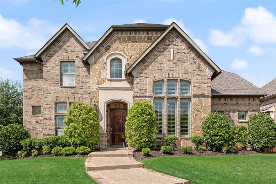 Situated on a premium corner lot in the highly sought-after Castle Hills community, this stunning 5-bedroom, 4-bath home offers the perfect blend of elegance, comfort, and lifestyle. Castle Hills is known for its master-planned design, scenic parks, golf course, and vibrant community atmosphere.
The thoughtfully designed floor plan features rich nail-down hardwood floors, plantation shutters, and formal living and dining areas. The oversized kitchen is a chef’s dream with granite countertops, a large island, gas cooktop, butler’s pantry, and abundant cabinetry—ideal for everyday living and entertaining. The first floor includes a private primary suite and a secondary guest bedroom. It also features an office to work from home.
Upstairs you will enjoy 3 more bedrooms and 2 full bathrooms. Also offers a spacious game room, wet bar, dedicated media room, and a charming Juliet balcony overlooking the main living area. Enjoy the views with an outdoor balcony, great for coffee or reading.
Step outside to a resort-style backyard oasis featuring a sparkling pool and spa with waterfall, outdoor kitchen, and a stone fireplace—perfect for relaxing or hosting. The professionally landscaped yard and recently stained board-on-board fence provide both beauty and privacy. You have the convenience of 3-car garage with racks for storage. This exceptional corner-lot property delivers luxury living in one of the area’s most desirable communities. If you live in Castle Hills your children have access to $10,000 college scholarship per child. Top rated Elementary School in Lewisville ISD. Middle School and High School are just minutes away. Great location close to Grandscape, Legacy West, The Star, Frito  Lay, Toyota and JP Morgan. Costco and HEB are coming soon to this area. DFW airport is only 20 minutes away and Downtown Dallas is about 30 minutes away.