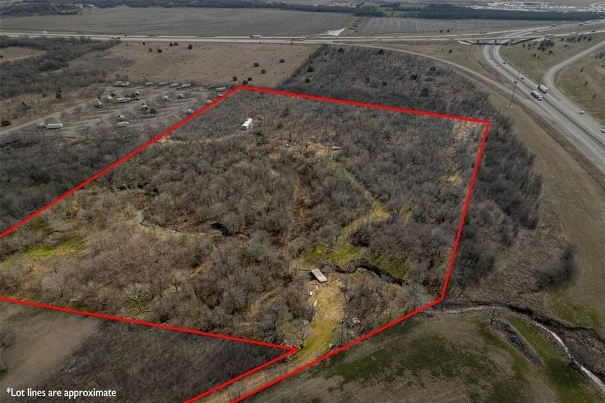 Looking to seize a rare opportunity in Texas real estate? This exceptional piece of land, located right off I-35 and County Road 4235, offers prime accessibility and limitless potential. Positioned on the same exit as the new Hillsboro Buc-ee’s, this property is a gateway to opportunity, whether you envision a private ranch, a thriving business, or a scenic retreat. With 686 feet of highway frontage, this expansive tract provides incredible visibility and convenience, all while maintaining the peaceful charm of country living just an hour from Dallas, Fort Worth, and Waco. Nature lovers and outdoor enthusiasts will appreciate the mature trees, abundant wildlife, and seasonal beauty of “Little Hickory Creek,” which winds through the landscape for approximately 550 feet. This property is a dream for hunting, wildlife watching, or off-road adventures, with rolling terrain that adds character and dimension to the land. The existing dirt can be backfilled to both ends of the bridge, offering the option for a more level crossing to enhance accessibility. The land itself is rich with fertile blackland soil, making it ideal for farming or sustainable agriculture. Toward the back of the property, multiple acres of flat, evenly graded land sit outside the floodplain, creating a perfect canvas for a custom home, a commercial development, or a recreational haven. Utilities are conveniently located within approximately 100 feet of the entrance, streamlining future plans for development.
With a blend of accessibility, natural beauty, and unlimited potential, this is more than just land—it’s an opportunity to create something truly special. Whether you’re an investor, developer, or someone looking to build your Texas dream, this property is ready to bring your vision to life. Don’t miss your chance to own a prime piece of land in one of the fastest-growing regions in the state.