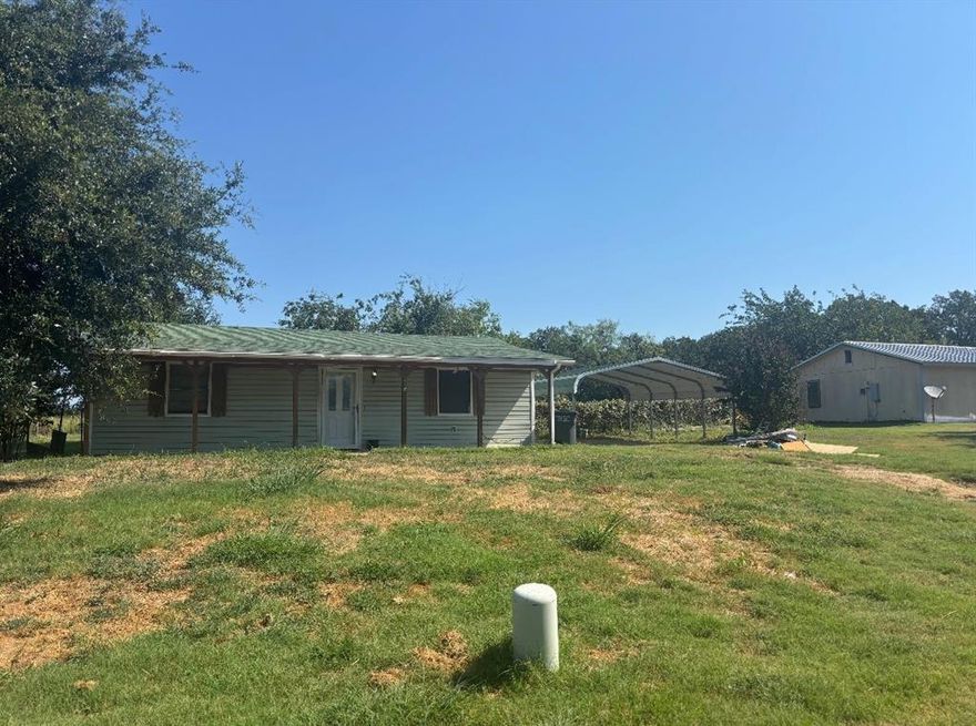 Country Living on this large lot on quiet street. This updated 2 bedroom 1 bath features open concept Kitchen through Large living room. Includes laundry room with washer and dryer connections Updated Kitchen and bathroom with plenty of closets. Carport for 2 cars. Nice big front porch Also has a large storage barn if needed inside the fenced yard bring your dogs, cats, chickens or horses.

TENANTS LEASE OUT AT $1425 per MONTH. TWO INCOME PRODUCING WATER WELLS ON PROPERTY WITH ADDTL. $750-1000 per MO IN CASH FLOW! 
** Seller is negotiable on all package deal offers. 

Water wells convey only with a package offer on all three listings - including 105 Michael Lane - MLS #21037199 and 107 Michael Lane - MLS #21037205.

*Exterior photos are of 119 Michael Lane, interior is of 105 but layout and features are nearly identical. 119 Michael is occupied with a tenant.
*To schedule a showing, please call agent to confirm appropriate times, due to tenants.*