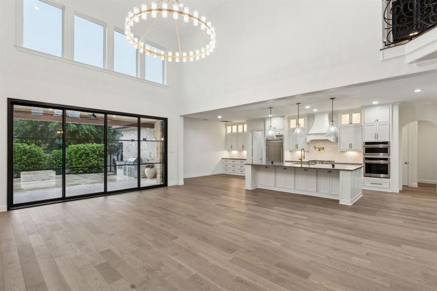 Luxurious Living with Unmatched Golf Course Views. Nestled within the prestigious Craig Ranch community, this Mediterranean style haven offers a seamless blend of refined elegance and functionality. From the understated yet stunning exterior to the richly appointed interior, every element has been meticulously designed and executed.
The heart of the home lies in its two kitchens, each equipped with state of the art Monogram and Cafe appliances and adorned with striking quartzite countertops. Pro Range and Rangetop, convection oven and Advantium speed cook oven, ice machine, Beverage center and 54 bottle wine reserve. Whether for formal events or casual gatherings, these kitchens are a chef’s dream. Expansive living areas, including the grand room with breathtaking 20 foot tile fireplace, Game Room and gargantuan Theater room ensure endless entertainment possibilities. The Primary suite includes a 4 person dry Sauna, Steam shower. The 2 primary bedroom suites with custom-designed closets provide ultimate comfort and privacy. High end wood flooring flows throughout the residence, showcasing quality and sophistication in every step.
With closets ingeniously designed for elevator shaft conversion, practicality meets potential in this stunning abode. Outdoor amenities rival the beauty of the interiors, featuring a full sliding glass wall opening up the interior to an outdoor living area complete with 2nd fireplace, outdoor kitchen and closet fire pit. Perfect for entertaining inside or out with magnificent views of the TPC Craig Ranch golf course and striking sunsets draping the golf course lake and western sky. The 3 car garage adds to the home’s convenience. Two office spaces for the busy professional or easily converted into gym workout area. The 2nd upstairs master suite allows for inlaws or friends to stay in comfort with huge bathroom and lockable walk-in closet with keypad access. Full wet bar outside theater room complete w beverage cooler and wine reserve.