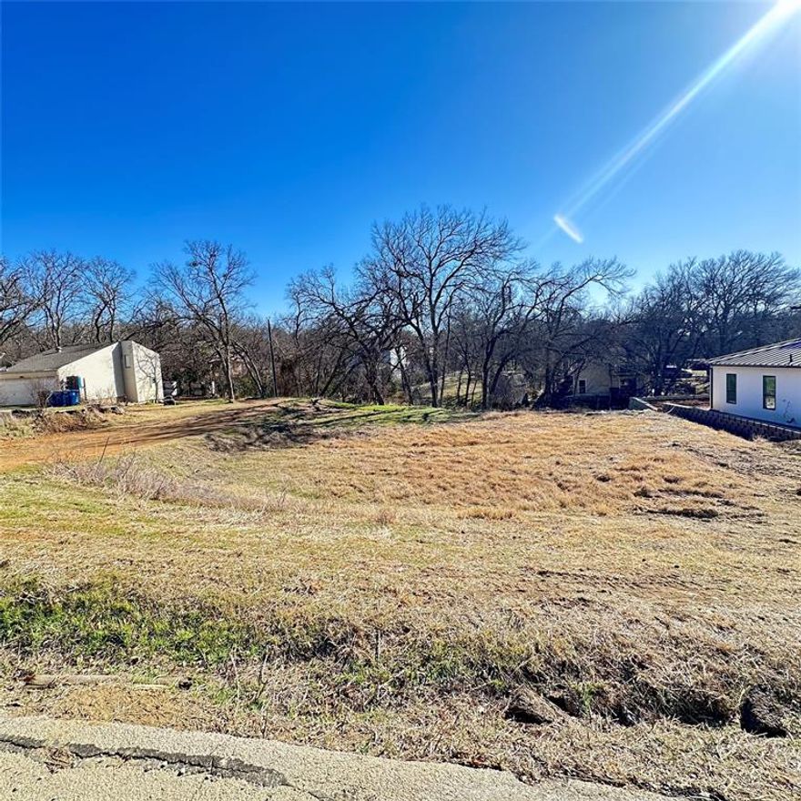 RARE FIND! Exceptional opportunity to own a cleared, level lot in the tucked-away Roanoke Hills neighborhood. Surrounded by mature trees and natural beauty, this lot offers close proximity to Lake Grapevine and nearby hike and bike trails. With ongoing improvements and redevelopment in the area, now is the perfect time to build. Bring your own builder and design a custom home in this quiet community that offers the charm of lakeside living with convenient access to surrounding amenities. Do not miss this opportunity.