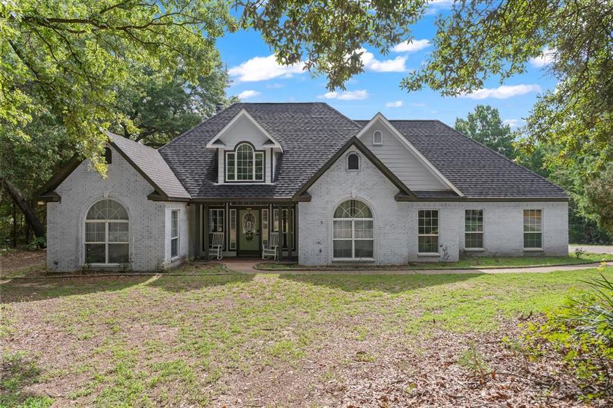 Looking for a peaceful retreat in East Texas? This home sits on 1.88 acres with beautiful trees all around. It has 4 bedrooms, 2 baths, formal dining and living room with vaulted ceiling and wood burning fireplace. Vinyl plank throughout including recently replacing all carpet in bedrooms and stairs. Fresh paint inside and out! Outside, you will find a covered patio with sink and extended concrete to enjoy the country setting. Other updates include water heater, garage door, dishwasher and roof (2021).