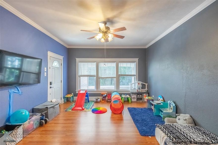 Charming historic home on a corner lot offering character, space, and modern updates. Built in 1923, this property features over 2,200 sq. ft. with 3 bedrooms, 2 full baths, and a versatile bonus room that can be used as a 4th bedroom, office, or second living area. Original hardwood floors, high ceilings, and spacious rooms highlight the home’s timeless design. The updated kitchen includes abundant cabinets and a large walk-in pantry. Enjoy relaxing on the wraparound front porch shaded by mature pecan trees, or take advantage of the detached garage with drive-through access, perfect for additional parking, storage, or workshop use. Conveniently located near downtown, shopping, dining, and both Abilene Christian University and Hardin-Simmons University. A rare opportunity to own a well-maintained home in a sought-after area with historic charm and modern convenience.