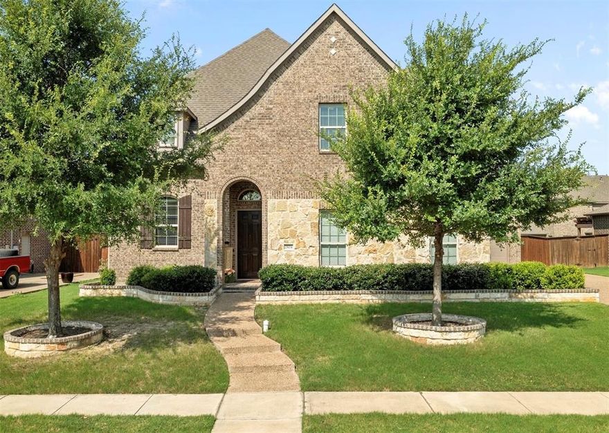 Welcome to this beautiful 5 bedroom, 4.5 bathroom home in the heart of Trophy Club, offering the perfect blend of elegance, comfort, and entertainment. Step inside to soaring ceilings and rich hardwood floors that flow throughout the main living areas. The spacious living room features a striking floor-to-ceiling stone fireplace and seamlessly connects to the breakfast nook and chef’s kitchen, which boasts granite countertops, a large center island, and ample cabinetry, ideal for everyday living and entertaining.

The main floor includes a spacious primary suite with serene views of the pool, as well as a guest bedroom with a private ensuite, perfect for visitors or multigenerational living. Upstairs, you'll find three generously sized bedrooms, a large family-game room, and a massive media room ready for movie nights.

Step outside and enjoy summer days in the sparkling pool complete with a spa, slide, pergola, and outdoor kitchen, your personal backyard retreat! Located in the desirable Northwest ISD with top rated schools, this home offers the lifestyle you’ve been dreaming of. Don’t miss your chance to own this Trophy Club gem!