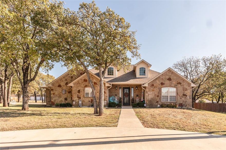 Located in a prime area just minutes from the hospital and walking distance to a scenic golf course, this 2611 square foot home offers a perfect blend of comfort, style, and convenience. With its classic stone and brick exterior, the home exudes curb appeal and sophistication. Inside, the spacious layout features 4 well appointed bedrooms and 3.5 bathrooms, including a unique half bath with its own private entrance off the back porch perfect for guests and added privacy. The large primary suite is a true retreat, offering ample space and a luxurious en-suite bath with dual sinks, a separate bathtub and shower, and high end finishes. The heart of the home is the open concept kitchen, which boasts beautiful stained grade cabinets, granite countertops, and stainless steel appliances. The inviting living room centers around a stunning stone fireplace, creating a warm and welcoming atmosphere highlighted by hardwood floors. Additional features include a 2 car garage, a spacious fenced-in backyard perfect for outdoor activities, and plenty of storage space. Whether you're relaxing in the large primary suite or entertaining guests in the living areas, this home offers everything you need for modern living with a touch of elegance. This home's combination of luxury finishes and prime location makes it an unbeatable choice. Don't miss the opportunity to make it yours!