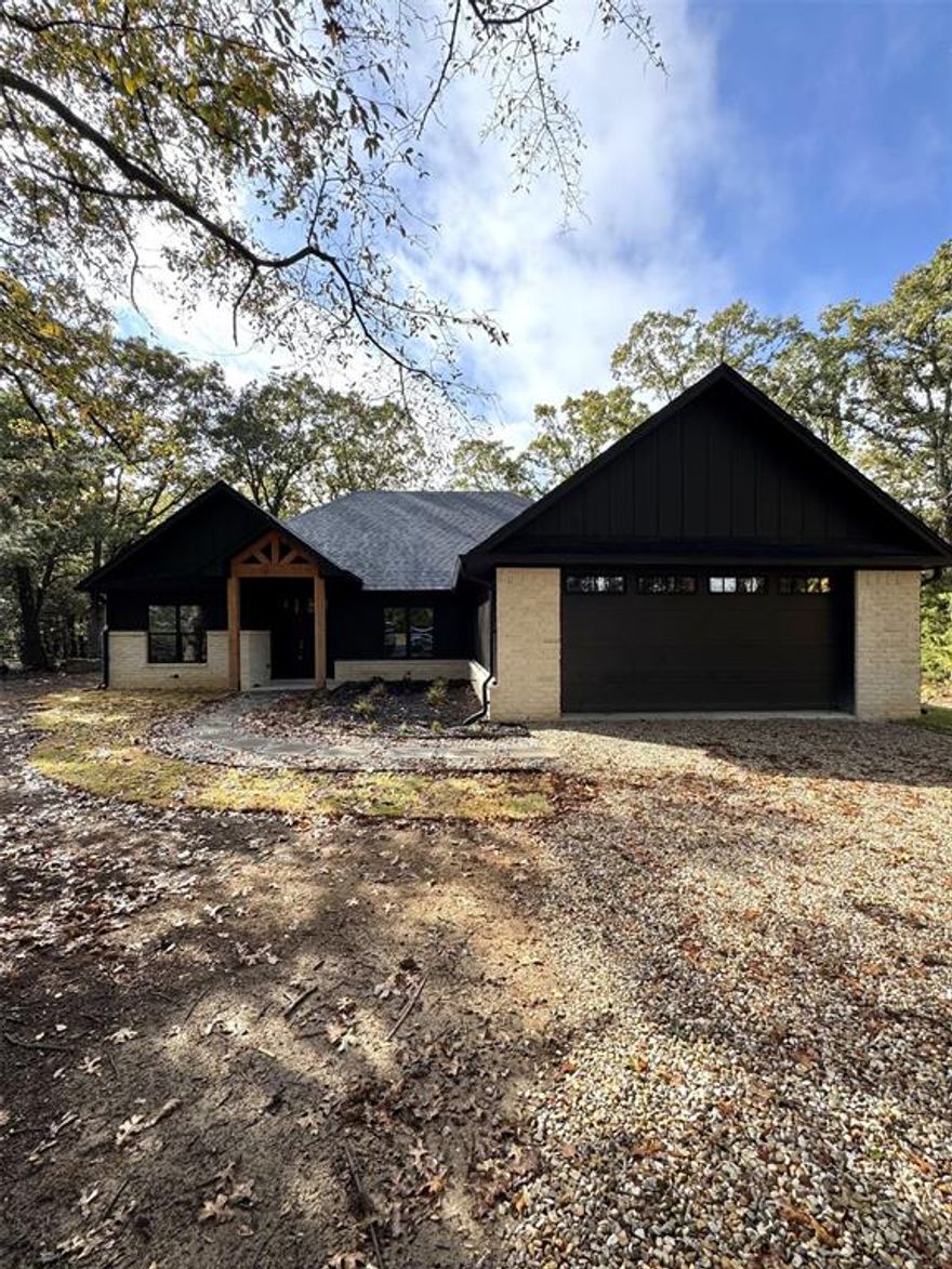 This nearly complete new build offers all the benefits of a custom home with the perfect location, just 5 minutes north of Paris, TX. You get true country living on a huge lot—just over an acre—surrounded by gorgeous, mature trees.

This stunning home features a highly sought-after layout with 3 bedrooms, 2 full bathrooms, and a private office. The open floor plan is bright and airy, boasting elegant 9-foot ceilings throughout and a dramatic, vaulted ceiling in the living room. The kitchen is a showpiece, equipped with custom cabinets, premium granite countertops, a large island, and a full set of brand new stainless steel appliances. Plus, enjoy peace of mind and lower bills thanks to high-efficiency spray foam insulation and modern LED lighting. Outdoor entertaining is easy with a spacious 17x18 deck, and there's a practical true two-car garage. This is your chance to own a modern, efficient, and spacious new home in a quiet setting so close to town!