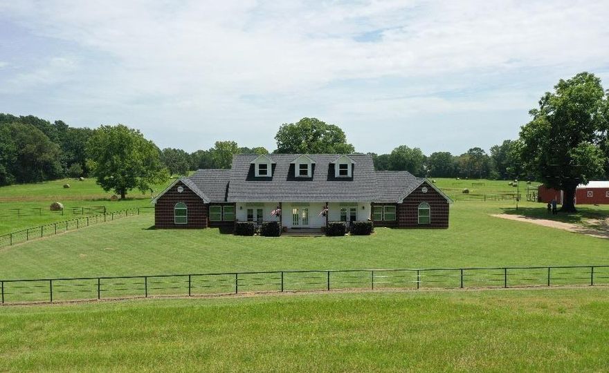PRICE REDUCED!! This stunning 28.49-acre property is the perfect setup for horse enthusiasts, ranchers, or anyone looking to enjoy country living with all the right amenities. The spacious 2,323 sq ft home offers a smart layout with two master suites—one on each side of the house—with total of 4 bedrooms, providing comfort and flexibility for multi-generational living or guests. Enjoy quiet mornings on the charming front porch, and cool off in the in-ground pool during the summer. A versatile HORSE barn with automatic waterers, a pipe-fenced yard, and a well-maintained horse barn make this property truly move-in ready for livestock. There’s also a large shop, ideal for storage or hobbies, and a stocked pond with big fish perfect for relaxing afternoons or weekend fun. The land is not only beautiful—it’s productive, with hay production already in place and fruit trees adding a sweet touch of country charm. Whether you’re raising horses, looking for a private homestead, or simply want space to roam, this property offers it all. There are two single car carports, one on each side of the shop. The shop has a toilet and shower, so there will be 3.75 bathrooms. Property is only 5 miles to Lake Bob Sandlin public boat launch. The refrigerator will stay with the property.