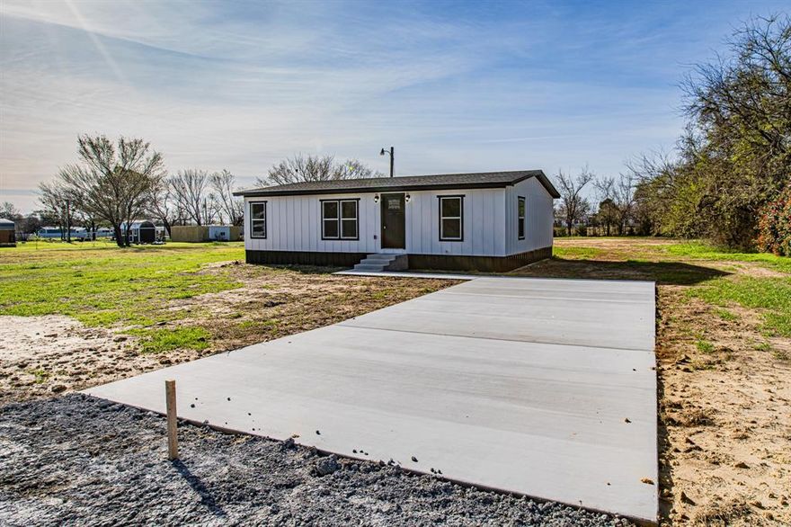 Rare opportunity to own a fully reconstructed 3-bedroom, 2-bathroom home on a sprawling, nearly 1-acre lot with no HOA! This is not your typical remodel—this home has been meticulously rebuilt from the frame out with modern efficiency and high-end finishes. The exterior features a brand-new roof, siding, skirting, windows, and doors, plus a fresh concrete driveway. Inside, enjoy a chef’s kitchen boasting custom cabinetry, sleek quartz countertops, and a full stainless steel appliance package including a range, microwave, and dishwasher. The bathrooms are a standout with custom-tiled tub and shower surrounds. Energy efficiency is a priority with a brand-new central heat and air system. Experience the peace of mind of a new construction feel combined with the freedom of nearly an acre of land. This turn-key property is a must-see!