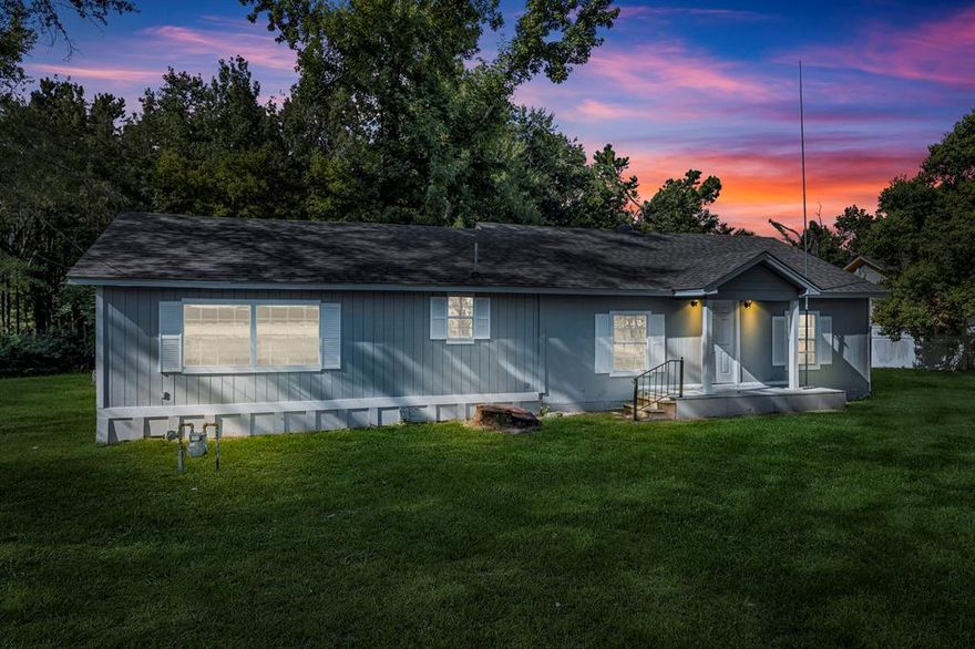 Tucked away on a serene 0.428-acre lot and surrounded by peaceful, wooded land, this updated East Texas gem offers all the charm of country living with the conveniences of town just minutes away. Located right across from the local fire department, this home sits in a community known for its friendly folks, Friday night lights, and easy access to both Tyler and Lake Tyler recreation.

Step inside this inviting 2-bedroom, 2-bath farmhouse-style home and be greeted by fresh updates throughout. A new roof, new HVAC system with new ductwork, and updated electrical and plumbing mean you can move in with peace of mind. The open-concept floor plan is full of light and warmth, thanks to new laminate flooring, modern light fixtures, and a fresh coat of paint inside and out.

The heart of the home—the kitchen—features a high-end 5-burner gas range, new stainless steel dishwasher and sink, and updated tilework that adds a clean, modern touch. Both bathrooms have been renovated with updated tile, fixtures, and vanities.

The spacious primary suite is a true retreat, complete with a tray ceiling, large walk-in closet, and a private entrance to a covered porch perfect for sipping sweet tea in the evenings. The ensuite bath includes a walk-in shower and updated vanity. The guest bedroom also offers a roomy walk-in closet and plenty of natural light.

Out back, enjoy a vinyl privacy fence and chain link border that keeps things peaceful while backing up to the trees. There's even a detached workshop—ideal for woodworking, crafting, or just extra storage.

You're just a short drive from Tyler’s shopping and dining, and close to Lake Tyler, making this the perfect blend of rural charm and modern convenience. Whether you’re looking for your first home, a weekend retreat, or simply a quieter pace of life, this property delivers that sweet East Texas blend of comfort, character, and calm.