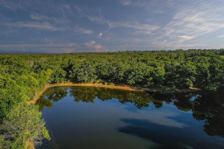 Bryson Oaks Ranch – 209 Acres in Jack County, Texas
Tucked away in the rolling hills just north of Bryson, Texas, sits the 209-acre Bryson Oaks Ranch—rich in character, history, and opportunity.
If you’re looking for a recreational escape, a working cattle property, or a place to build your legacy, this land offers a rare blend of natural beauty and seclusion that's hard to find in North Texas.

The landscape is diverse, ranging from rocky hillsides and open parks to thick stands of post oaks. A nice-sized pond is tucked among the trees, attracting wildlife and adding to the ranch’s natural charm. Live oaks and post oaks are scattered throughout, while mesquites and native grasses fill in the open areas. With over 160 feet of elevation change, the rolling topography creates dramatic views, rich habitat, and a true sense of adventure. The ranch feels larger than its acreage and should hunt accordingly.

Well-suited for both livestock and hunting, the ranch is cross-fenced and has solid perimeter fencing, ready to support cattle or other animals. There are no oil or gas production sites on the property—only a small underground pipeline located in the southern portion. No wind turbines are present. Wildlife is plentiful, with whitetail deer, feral hogs, and wild turkey frequently spotted. Game sign is abundant.

Several ideal building sites can be found across the ranch. Current access is via a short easement off North College Avenue, with road frontage on Dead End Road at the northeast corner. Electricity runs along the eastern border and is also near the southern edge of the property. Water well data on neighboring tracts suggests good potential for groundwater access.

The Bryson Oaks Ranch—209 acres full of possibility. A classic Jack County property with everything you’d want in a North Texas ranch.