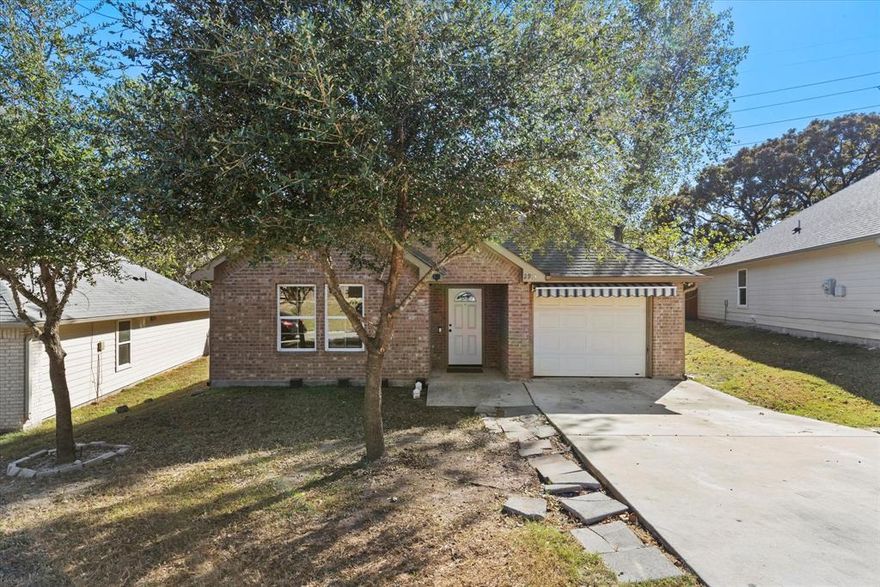 Welcome to this beautiful single story home with easy access to downtown Dallas, entertainment, highways, and more! Gorgeous wood-look tile floors invite you inside this open-concept floor plan offering a spacious living room which flows into the breakfast area and kitchen. Preparing home-cooked meals is a breeze in the fully equipped kitchen featuring sleek Whirlpool stainless steel appliances, granite counter-tops and breakfast bar for additional prep space or seating. Make your way to the expansive primary suite complete with a walk-in closet and attached bath with dual sinks and granite counter-tops. Two additional bedrooms share access to a well-appointed full bath with granite counter-tops. Step outside where the whole family will love spending time in the fully fenced backyard.