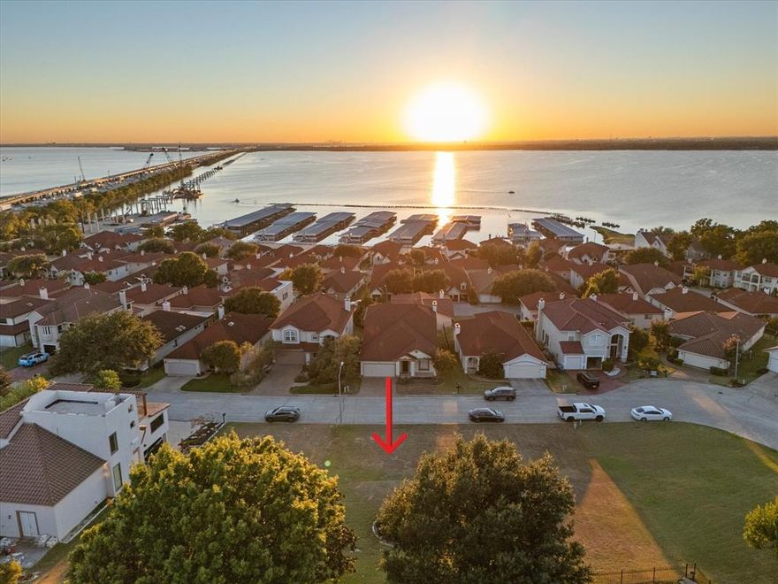 BYOBuilder. You just found the center of your new univerise! Perfect LOCK & LEAVE with LAKEVIEWS & VIEWS OF THE DT DALLAS FAMOUS SKYLINE....inside a GATED LAKEFRONT COMMUNITY with GOLF-TENNIS-POOL-CLUBHOUSE-PLAYGROUND & PICKLEBALL PLUS BOAT & RV STORAGE available on site. Lakeview homesite nestled on a quaint charming street 1 Min fromo I-30, 5 Miles to the George Bush, 22 miles from Downtown Dallas & 42 Miles to DFW Airport (approx 50 min) Just across the interstate from Rockwall's Harbor District, The Hilton Resort, Minutes to Historic DownTown Rockwall for shopping, fine & casual dining & the farmers market.  Lakeside Village showcases a BEAUTIUFL & CHALLENGING MAGNIFICENT Par three 9 Hole Golf Course. Harbor Bay Marina literally outside the gated entrance.